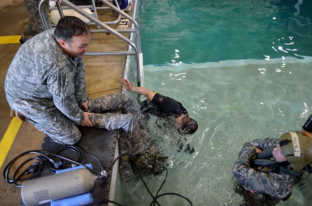 Maj. Christopher moenster holds the feet of Maj. Derrick - PICRYL ...