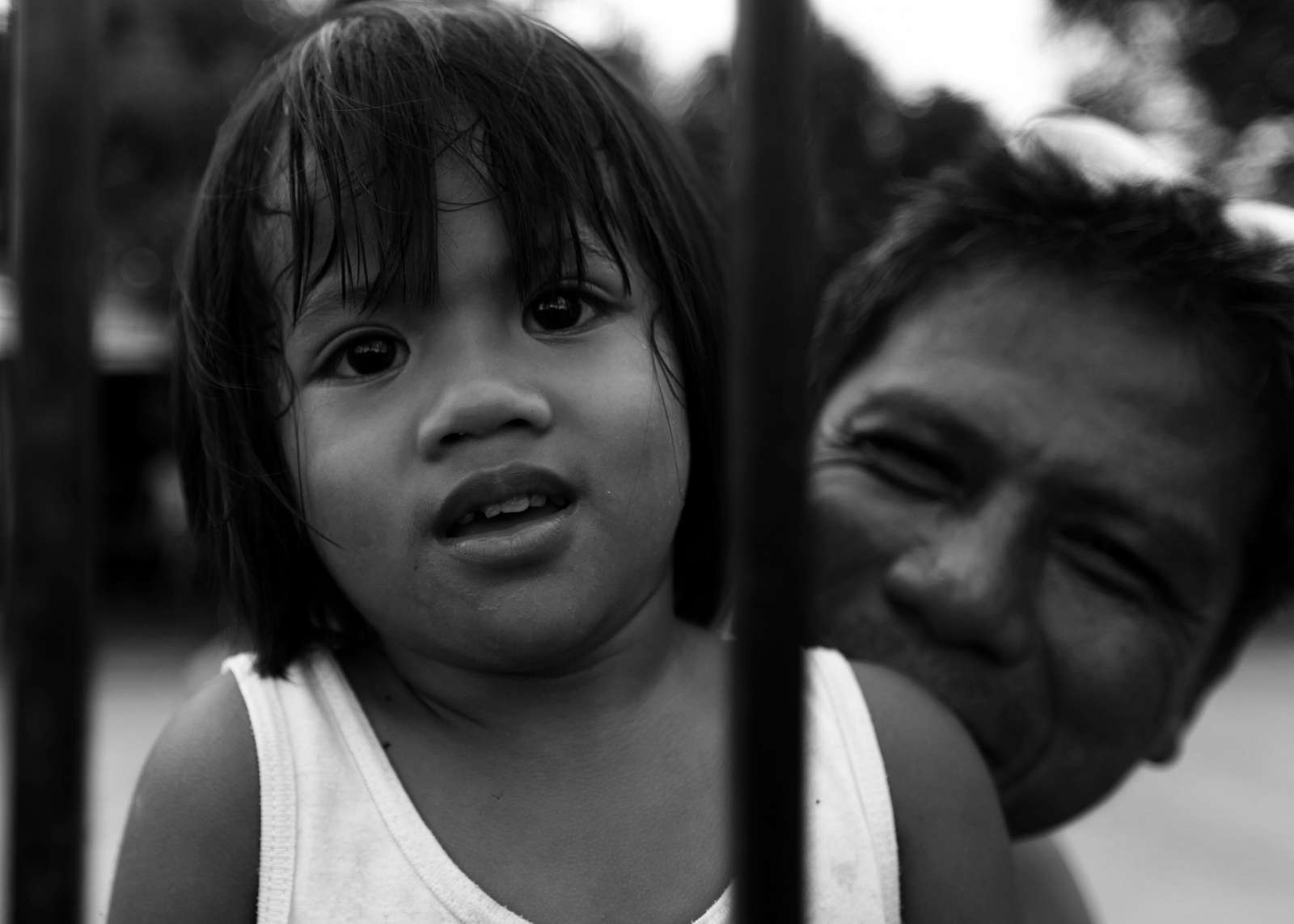 A local Filipino student is held up by her father as - NARA & DVIDS ...