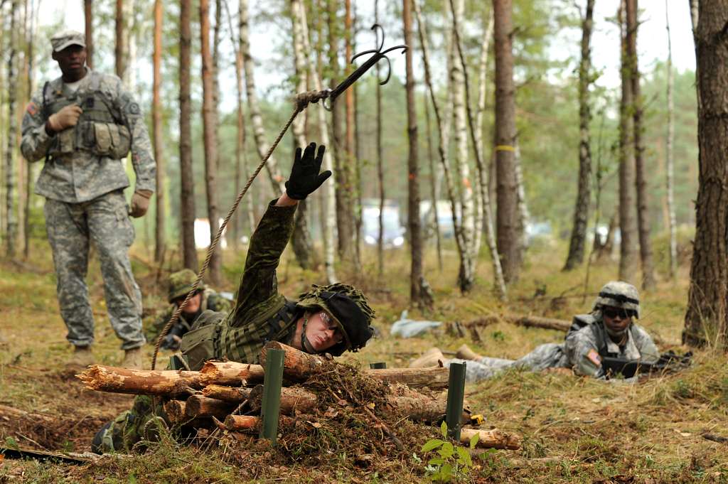 A soldier from Estonian army throws a grappling hook - PICRYL - Public  Domain Media Search Engine Public Domain Search