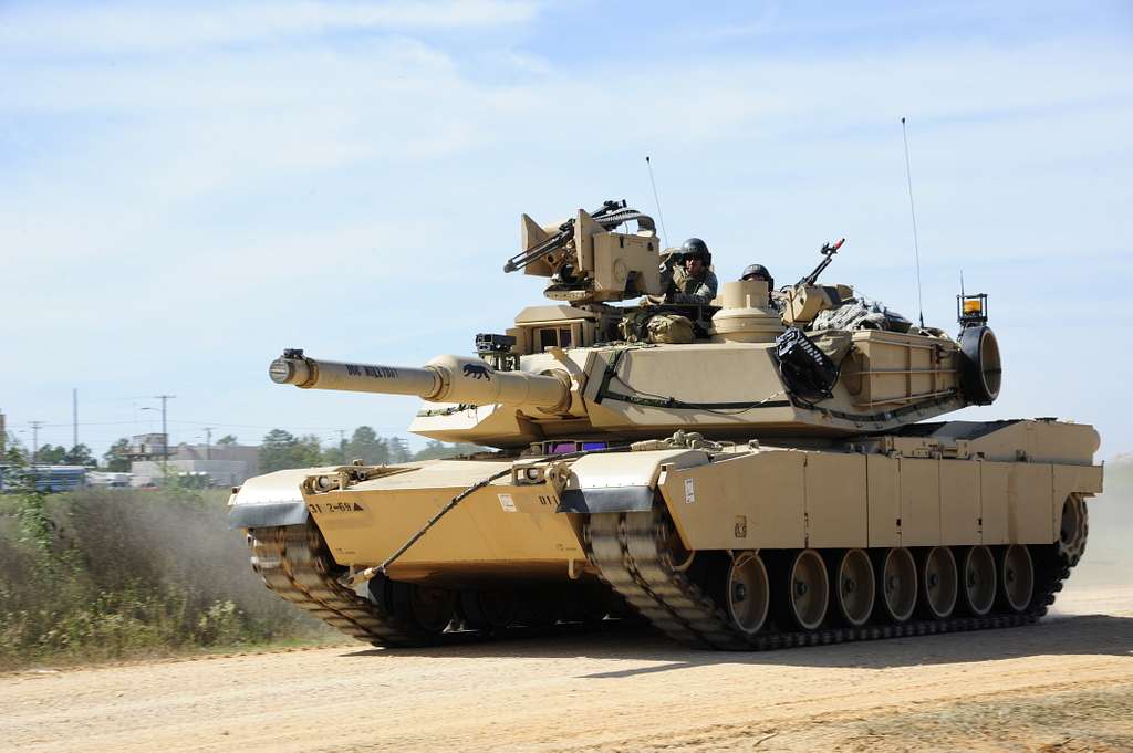 An M1A2 Abrams main battle tank performs tactical maneuvers - PICRYL ...