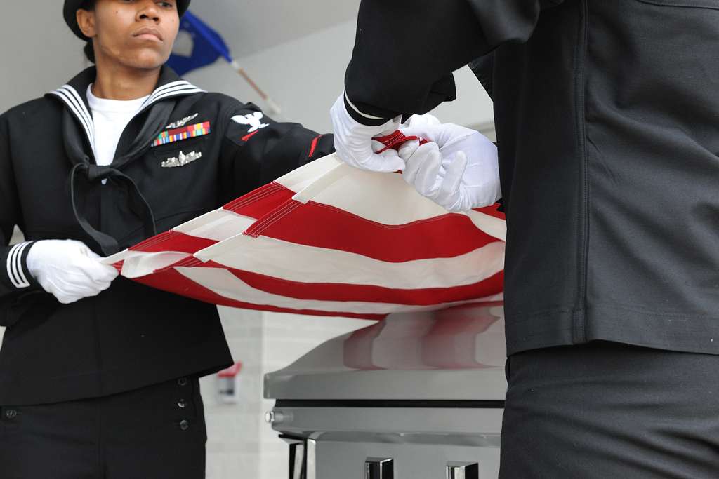 Members of the U.S. Navy Honor Guard fold the American - NARA & DVIDS ...