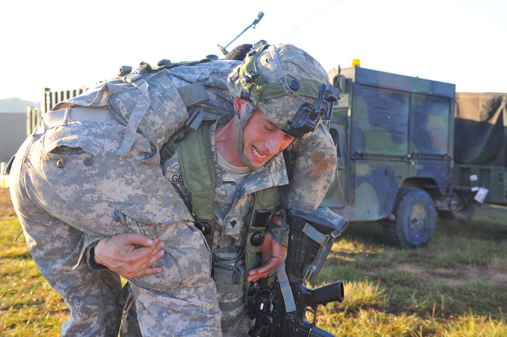 A U.S. Army soldier performs a fireman's carry on a - NARA & DVIDS ...