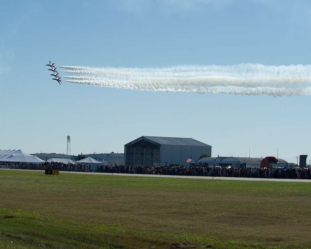 U.S. Navy Blue Angels - The Blue Angels jet pilots -- wearing throwback  gold flight suits -- commence their pre-flight walkdown at the first Blue  Angel flight demonstration of the 2014 air