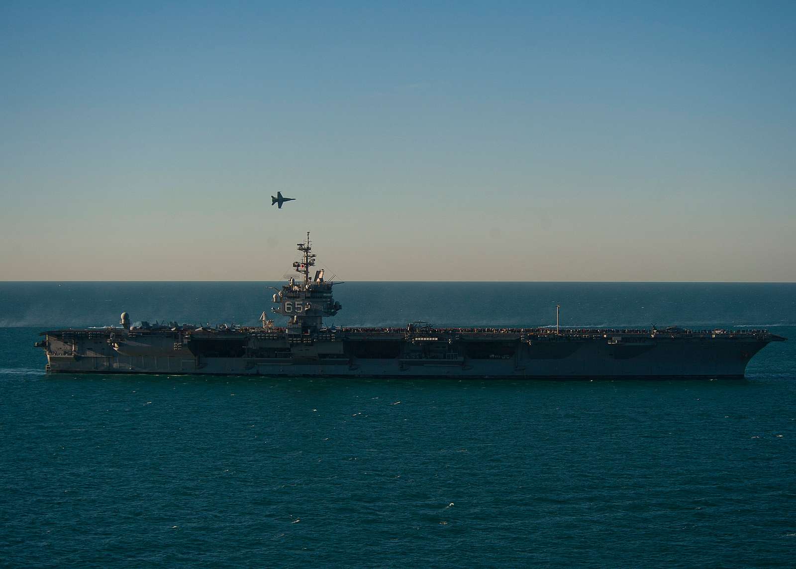 An F/A-18F Super Hornet flies above the aircraft carrier - NARA & DVIDS ...