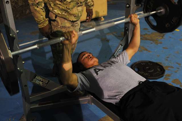 A U.S. Army soldier bench-presses 115 pounds during - PICRYL - Public ...