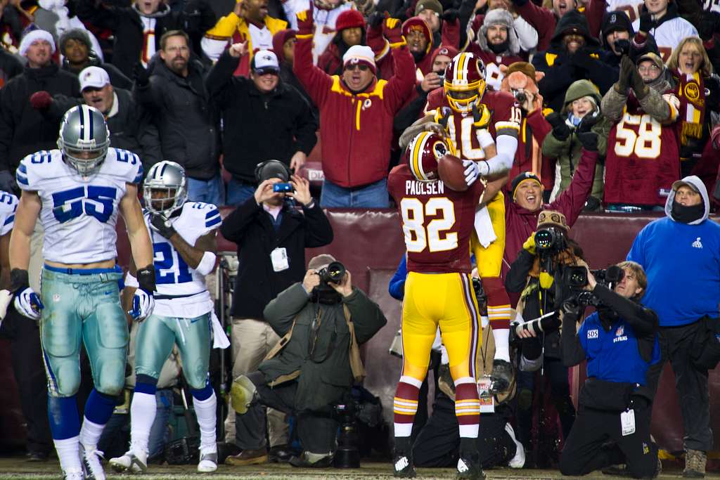 Washington Redskins quarterback Robert Griffin III celebrates a touchdown  by fullback Darrel Young during the second half of a NFL football game  against San Diego Chargers in Landover, Md., Sunday …