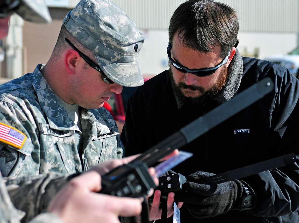 US Navy Engineman 2nd Class Anthony Bartelli (right) holds an