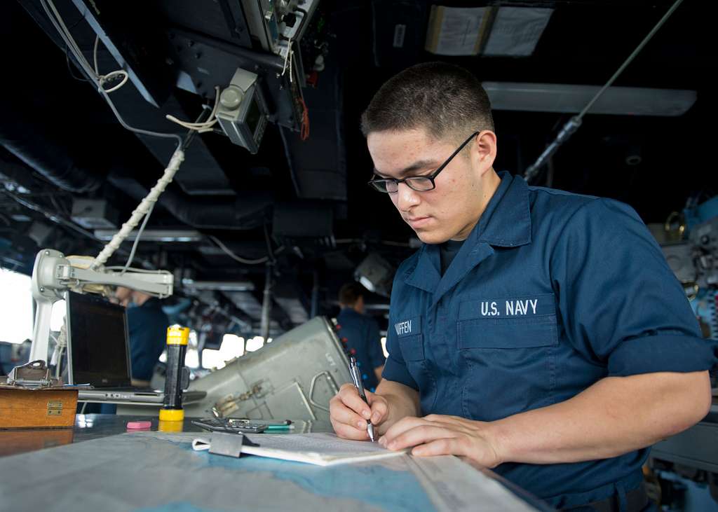 Quartermaster Seaman Thomas Hauffen makes a ship's - NARA & DVIDS