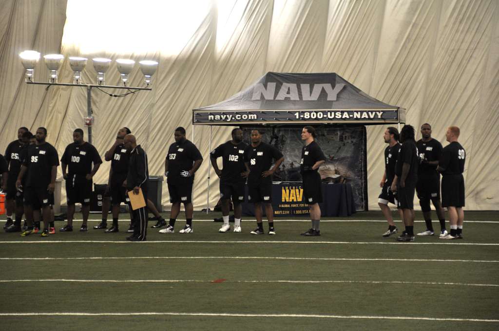 File:US Navy 070208-N-4965F-001 A young patron hands a football to