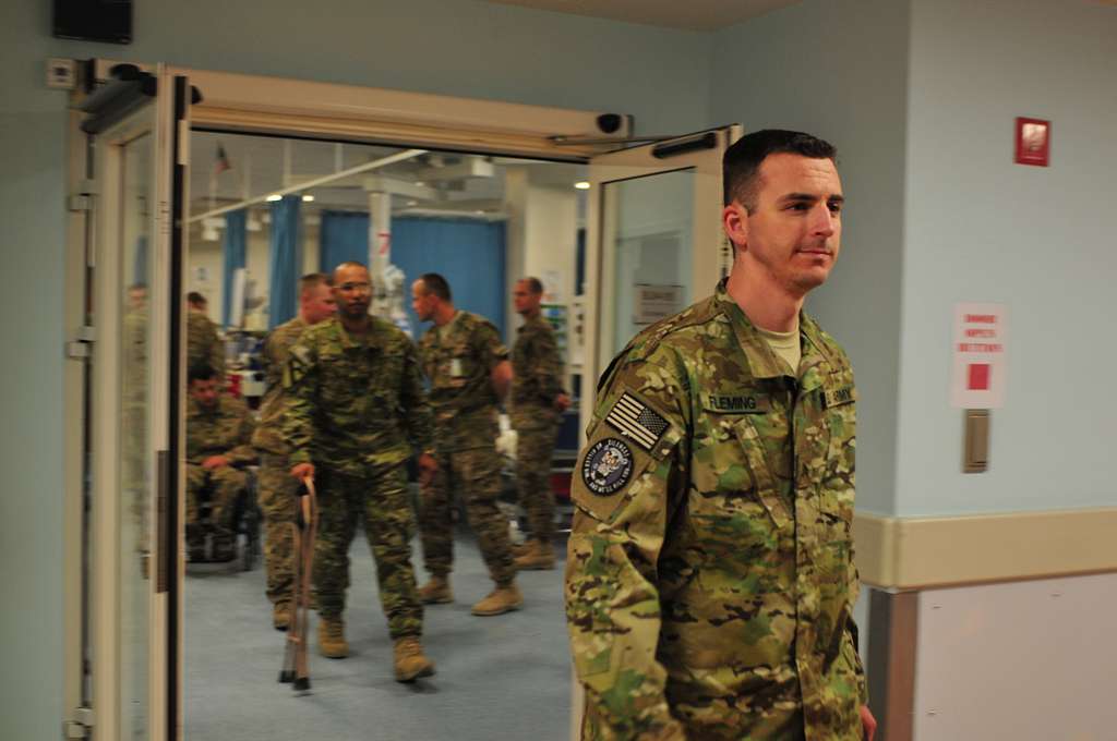 Retired U.S. Army Sgt. Brian Flemming crosses the hall PICRYL