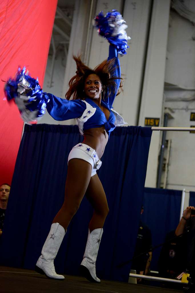 Dallas Cowboys Cheerleader Jackie Bob addresses sailors aboard the