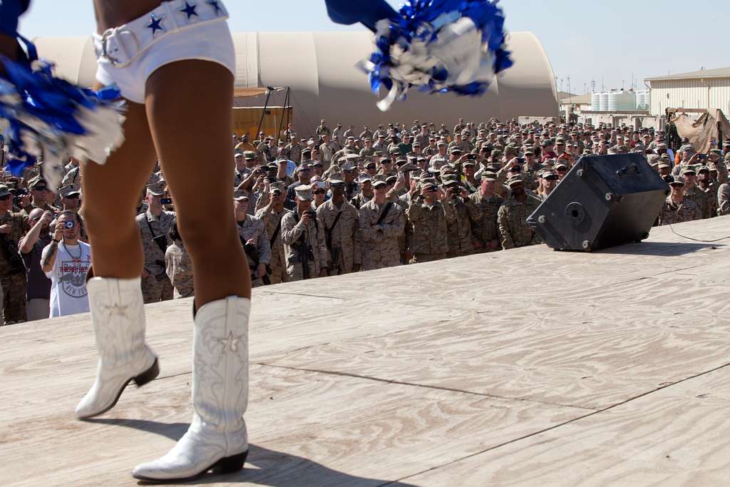 Dallas Cowboys Cheerleader Jackie Bob addresses sailors aboard the