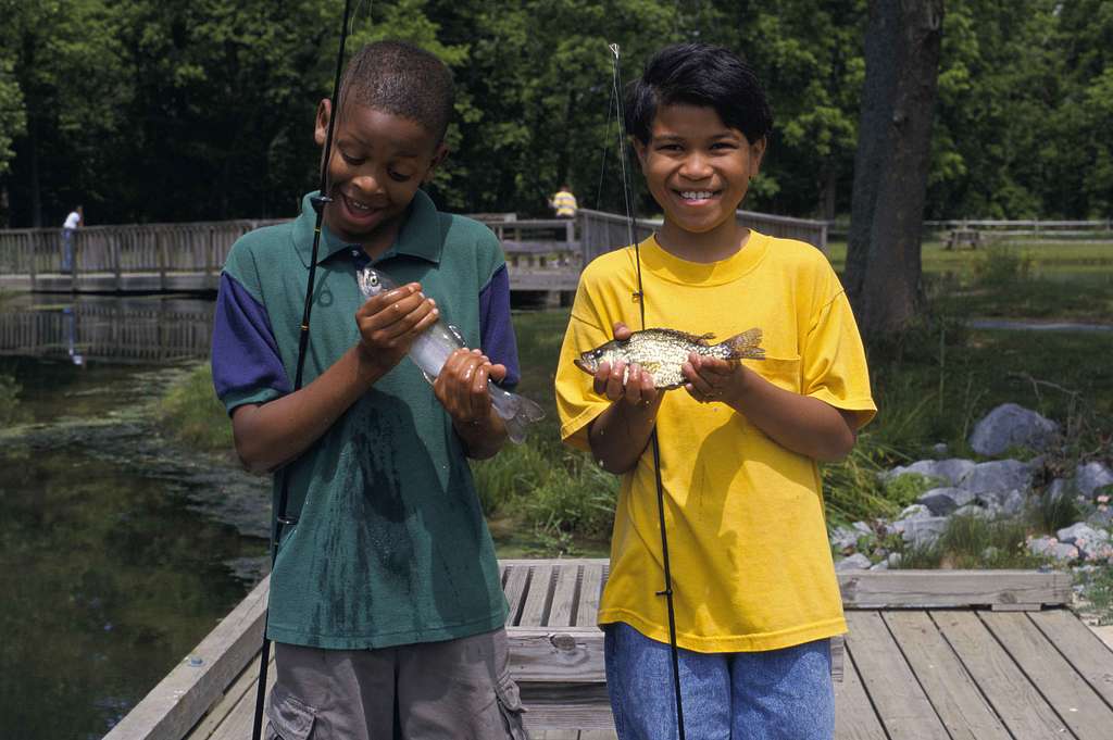 Two young boys show off their catched fish - PICRYL - Public