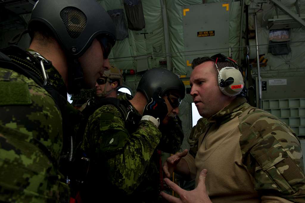 A Royal Air Force (RAF) jump master briefs jump masters - NARA