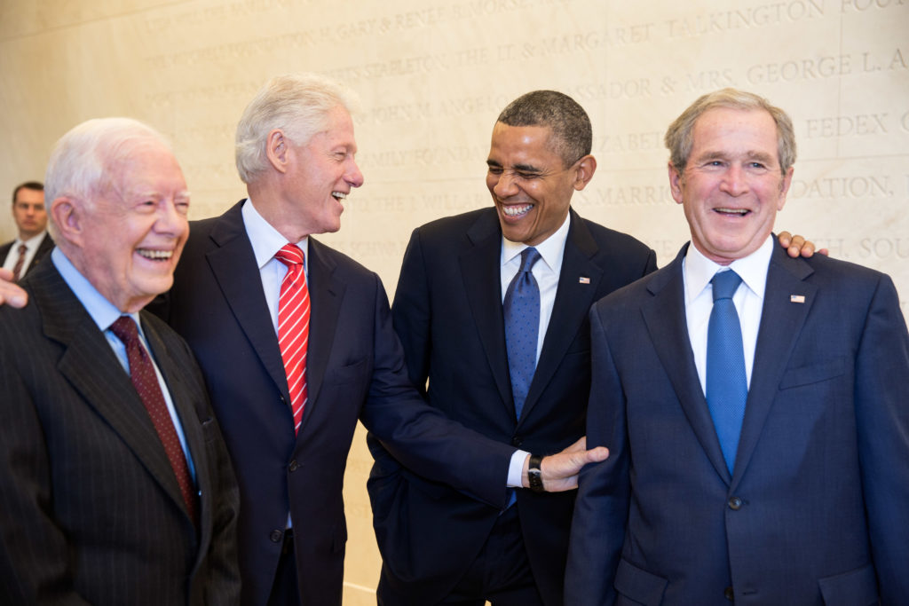 President Barack Obama - A group of men standing next to each