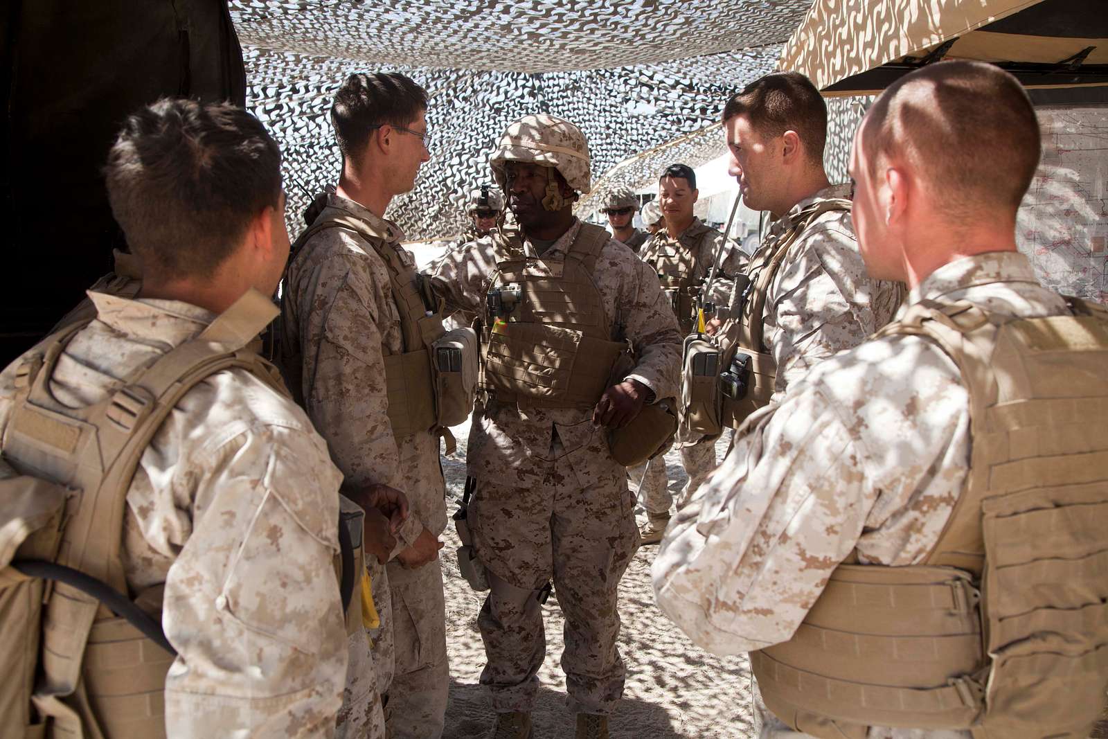 U.S. Marine Corps Sgt. Maj. Collin D. Barry, sergeant major, Marine Corps  Base Quantico, speaks to Marines and sailors at the Salute to Service Boot  Camp hosted by the Washington Commanders at