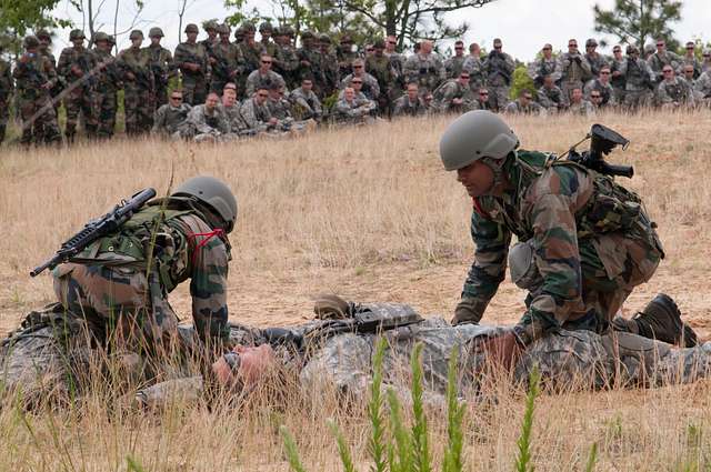 U.S. Army - An Indian Army paratrooper with the 50th Independent Para  Brigade hands his static line to a jumpmaster with the 1st Brigade Combat  Team, 82nd Airborne Division, in a mock