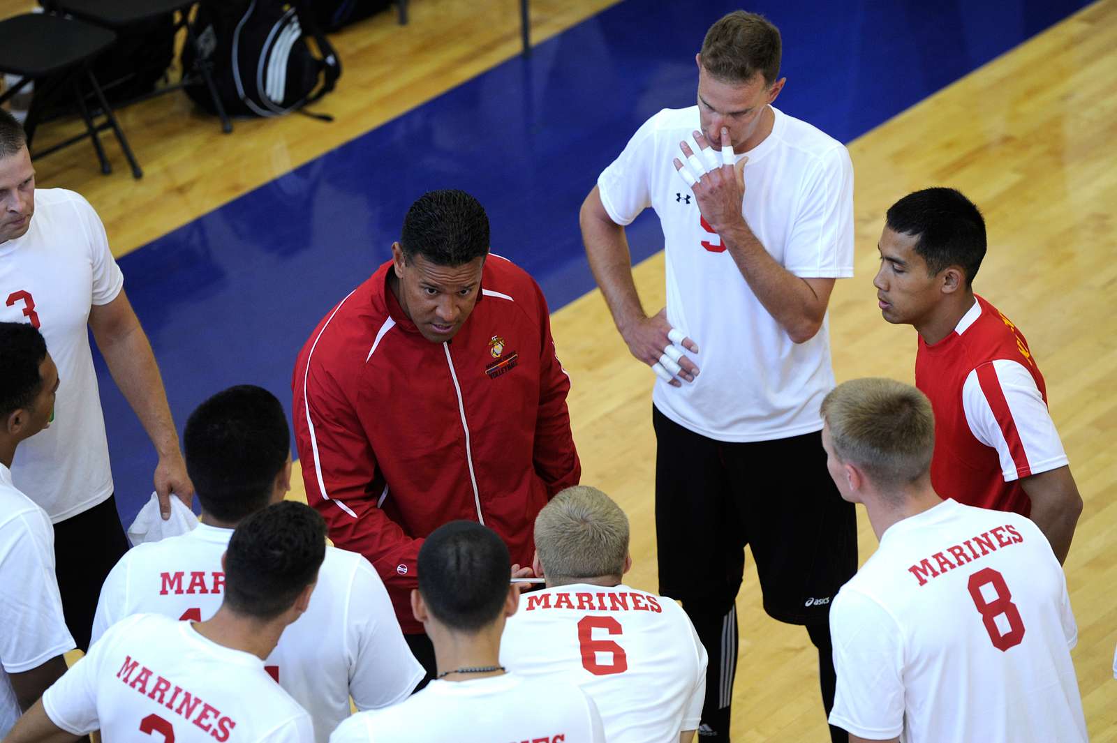 The United States Marines Men's Volleyball Team huddle - NARA & DVIDS ...