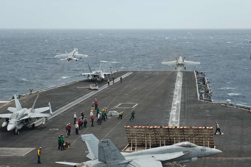 Two F/A-18 Super Hornets launch from the aircraft carrier - NARA ...