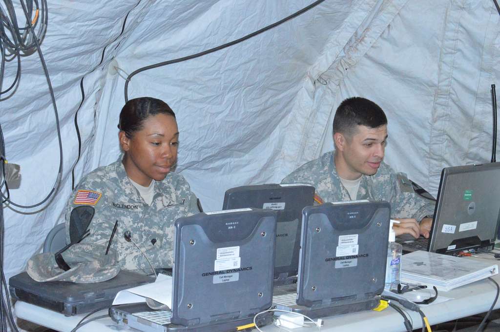 Spc. Jalexus McClendon, left, an information technology - NARA & DVIDS ...