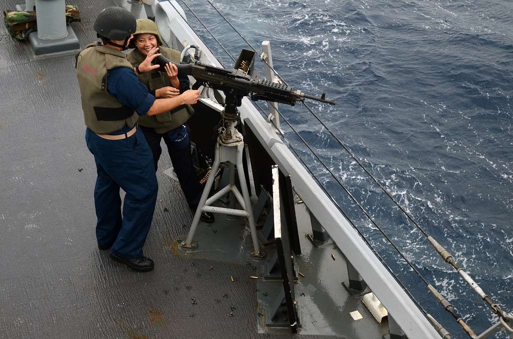 A Member Of The Philippine Coast Guard Smiles At Chief Picryl Public