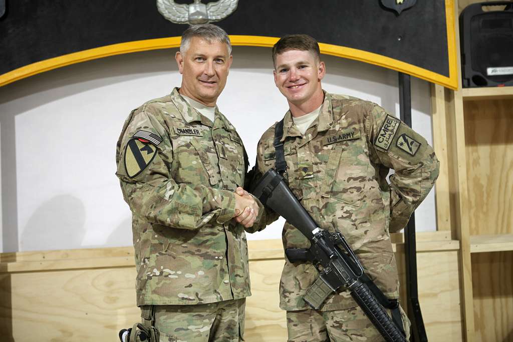 Sgt. Maj. of the Army Daniel A. Dailey poses with Screech, the