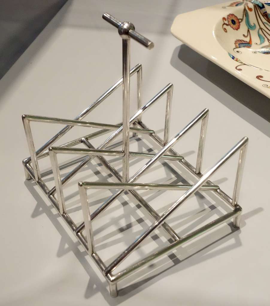 https://cdn2.picryl.com/photo/2013/10/30/toast-rack-by-christopher-dresser-1834-1904-made-by-tiffany-and-co-new-york-a2061c-1024.JPG