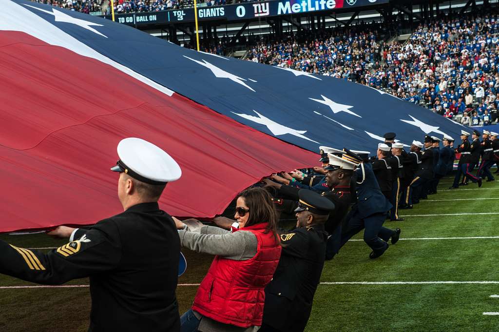 New Jersey National Guard Soldiers hold the American Flag along side other  service members and veterans at MetLife Stadium in East Rutherford, New  Jersey, Nov. 6, 2022. Soldiers of the New Jersey