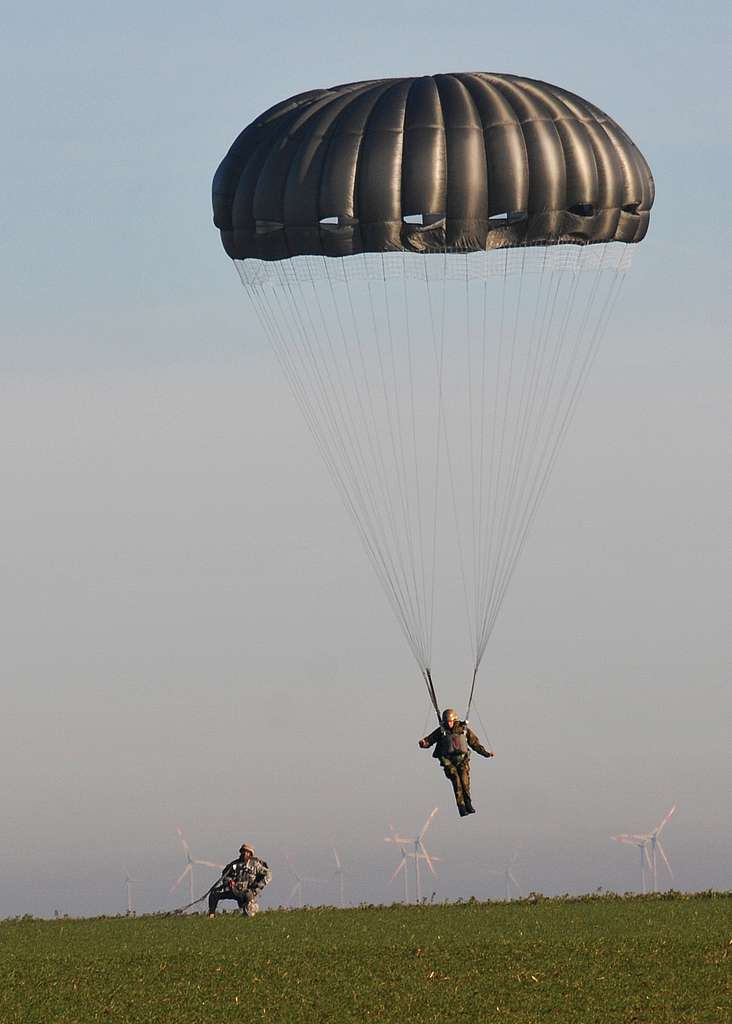 A German paratrooper lands on the Alzey Drop Zone as - NARA & DVIDS ...