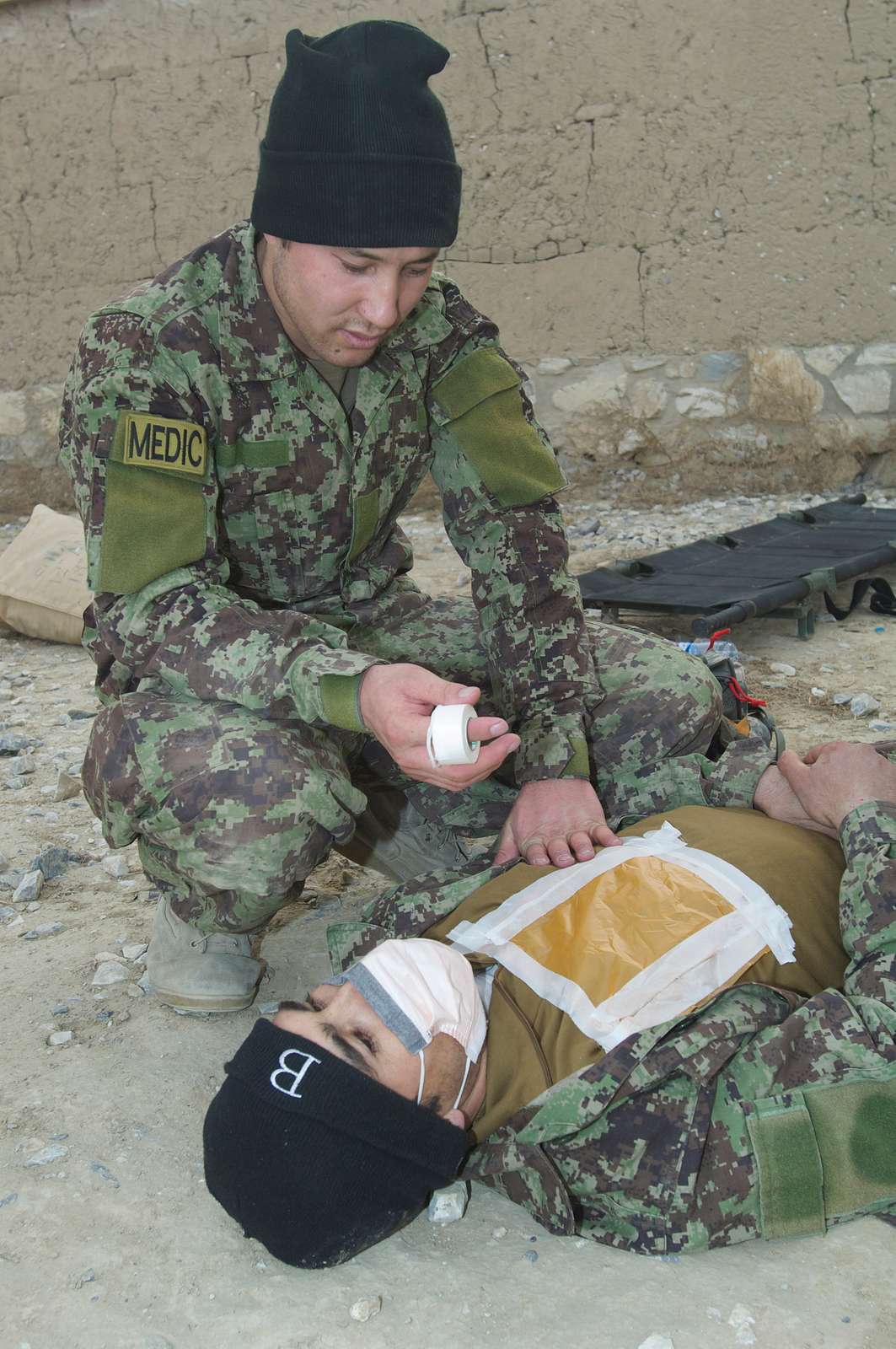 An Afghan National Army medic treats a chest wound - NARA & DVIDS ...