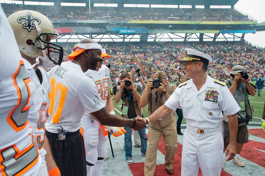 HALAWA, Hawaii – Gen. Vincent K. Brooks, commanding general for U.S. Army  Pacific and other distinguished guests stand along the sideline to watch  the opening play of the 2014 Pro Bowl at