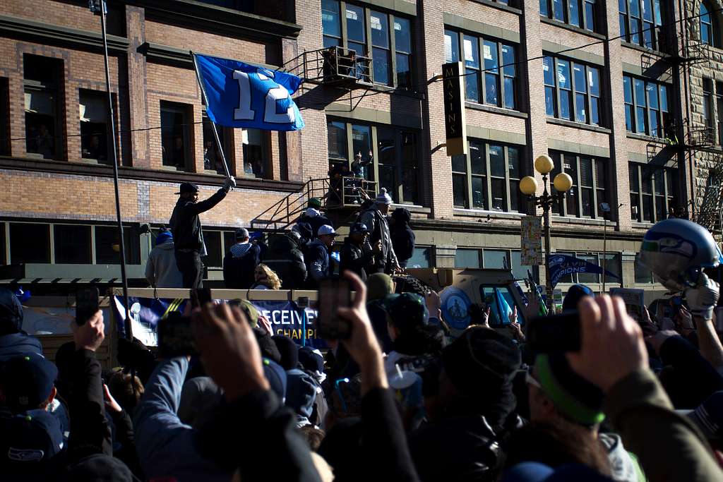 Staff Sgt. John McLaughlin leads the Seattle Seahawks onto the