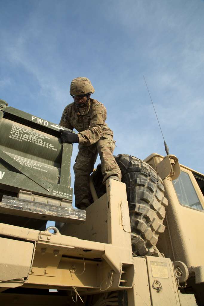 A coalition force member loads a High Mobility Artillery - PICRYL ...