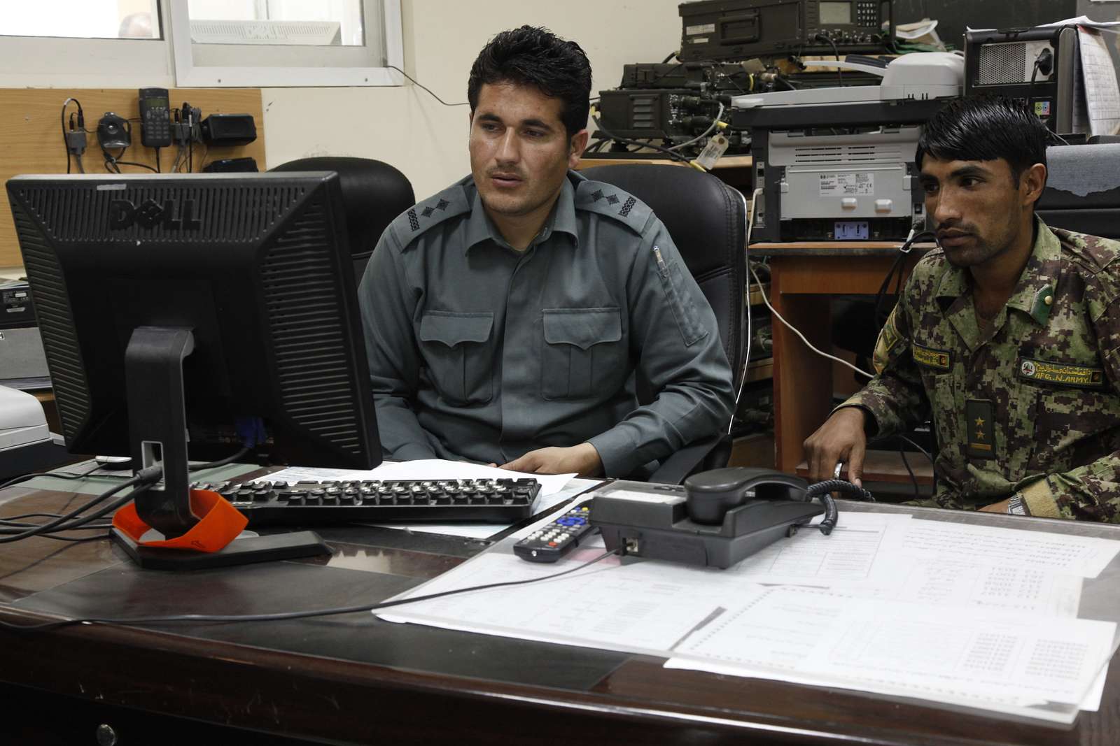 An Afghan Uniformed Police Officer, Left, And An Afghan - NARA & DVIDS ...