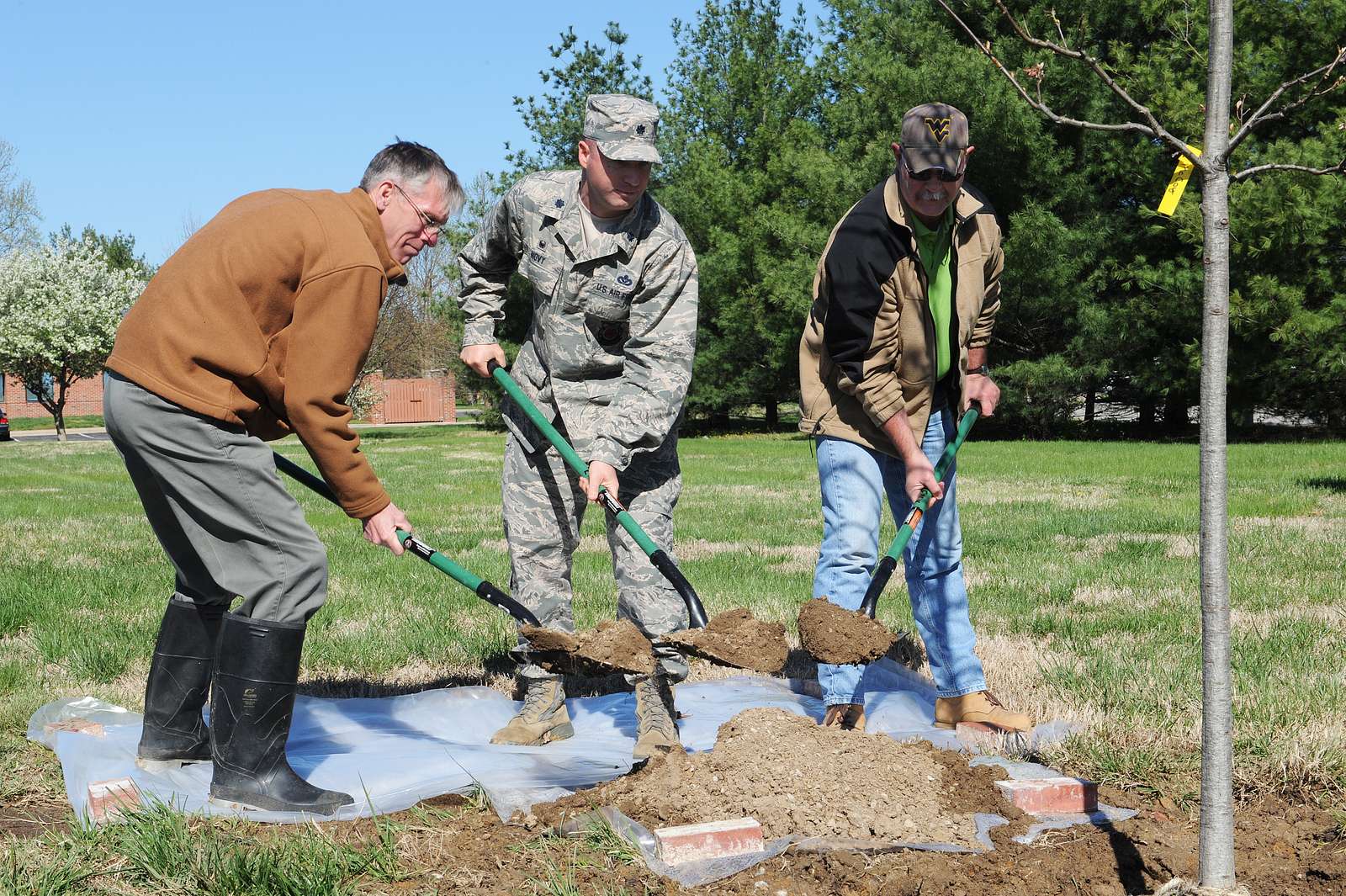 Keith Brumley, Lt. Col. David Novy, and Mark McCoy - NARA & DVIDS 