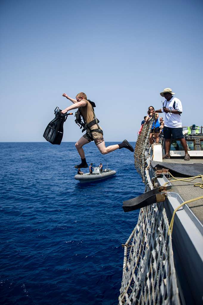 A Search And Rescue Swimmer Jumps Into The Arabian - NARA & DVIDS ...