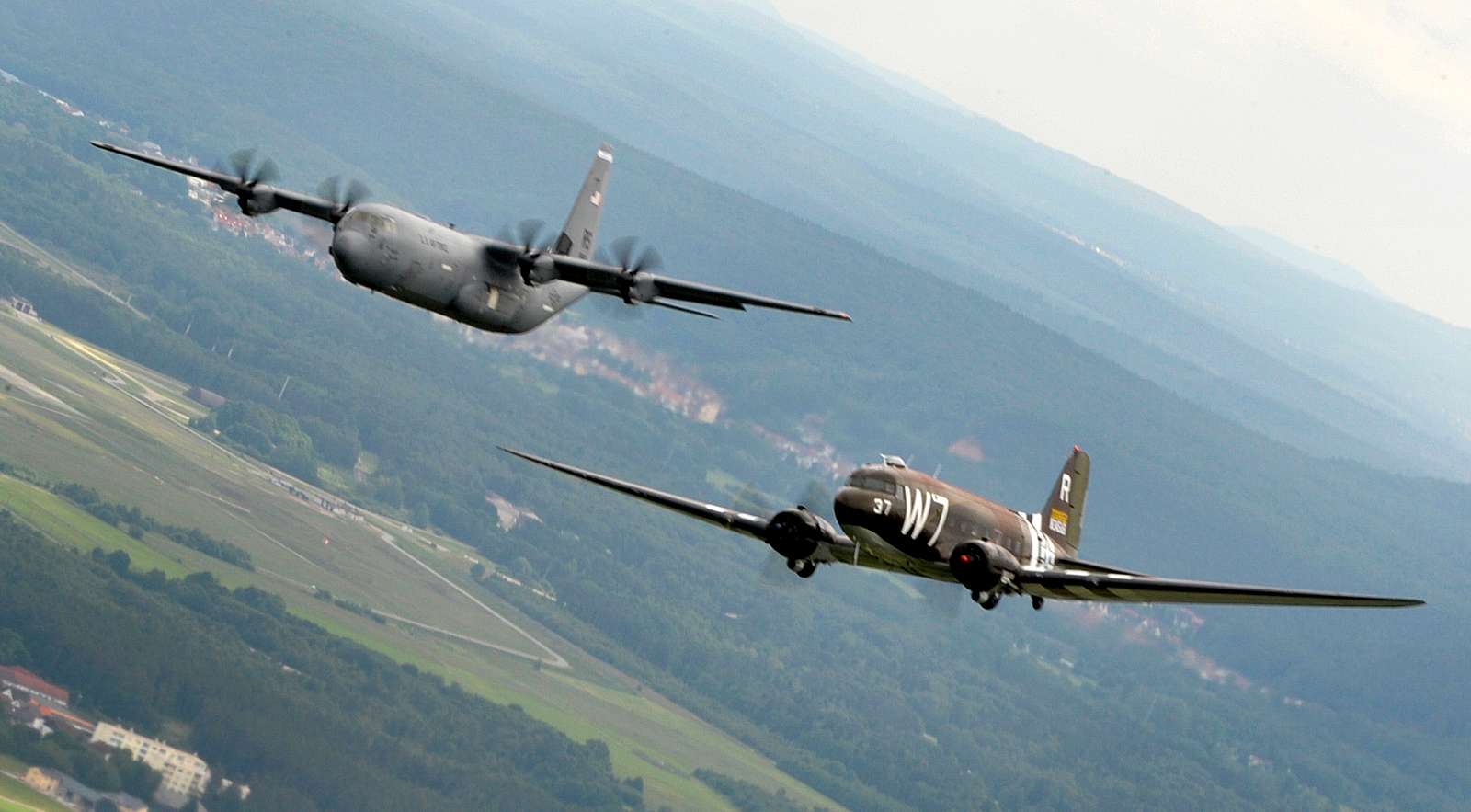 A Douglas C-47 Skytrain, known as Whiskey 7, flies - NARA & DVIDS ...