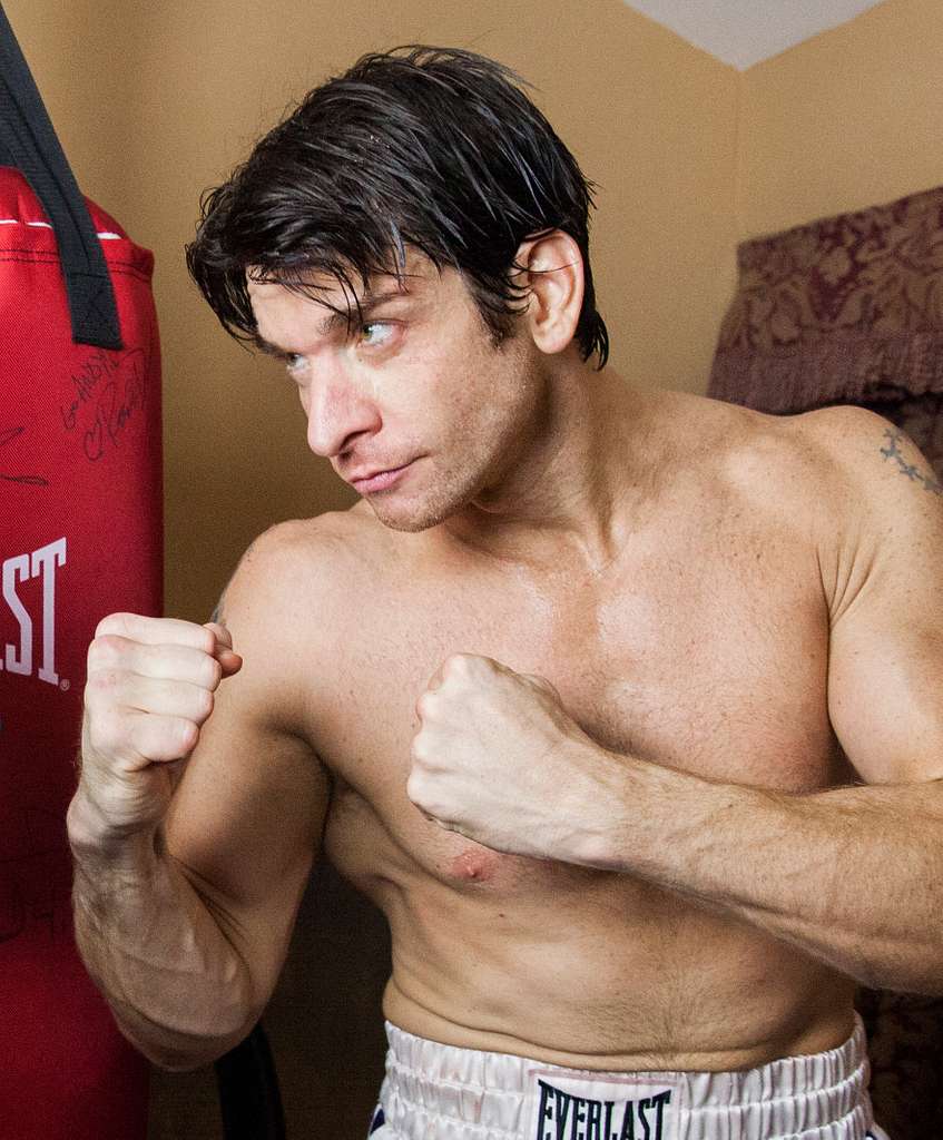 Andy Karl as Rocky - A shirtless man with a punching bag in his hand -  PICRYL - Public Domain Media Search Engine Public Domain Search