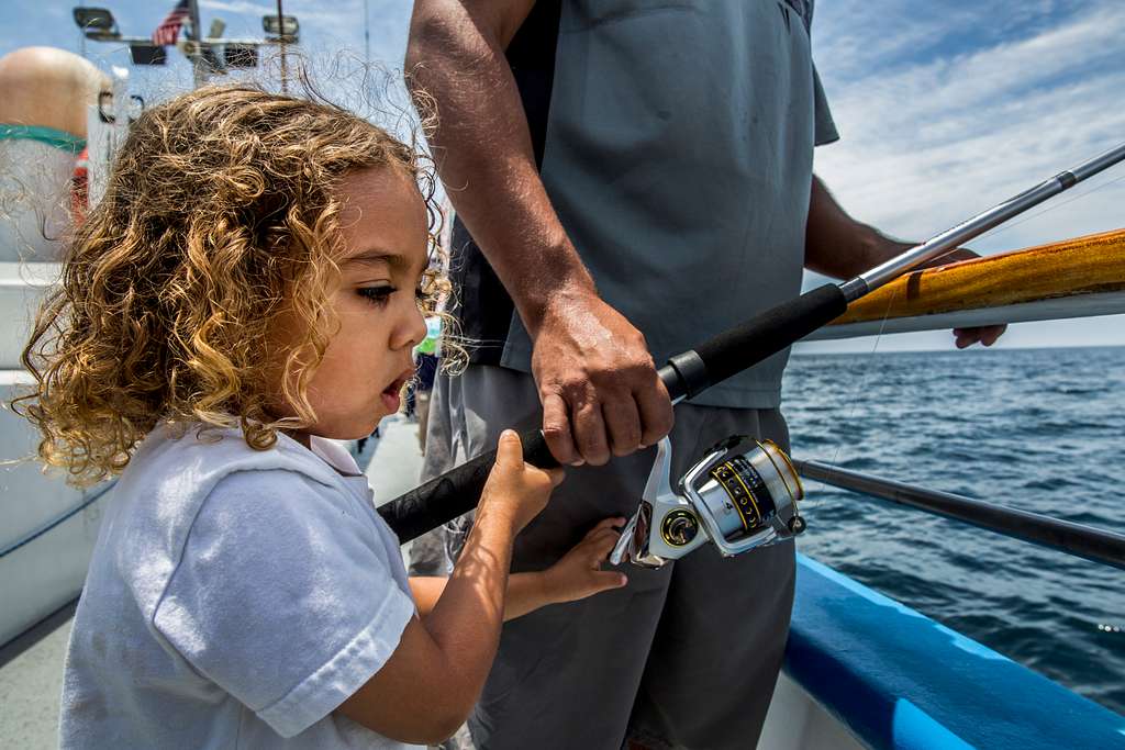 Major, 4, reels in a catch during a youth fishing trip - NARA