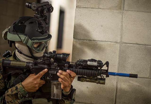 A member of the Peruvian naval special forces maintains - PICRYL Public ...