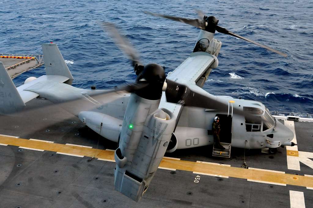 A tilt-rotor MV-22 Osprey prepares to takes off from - NARA & DVIDS ...