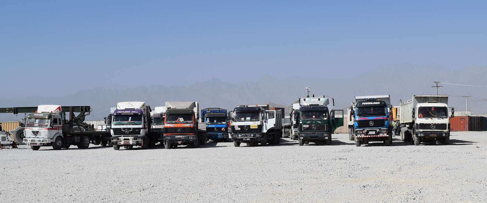 Afghan trucks await their turn to pick up equipment - NARA & DVIDS ...