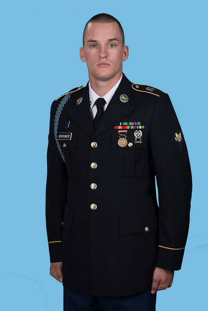 Spc. Ryan Montgomery. - A man in a military uniform poses for a picture ...