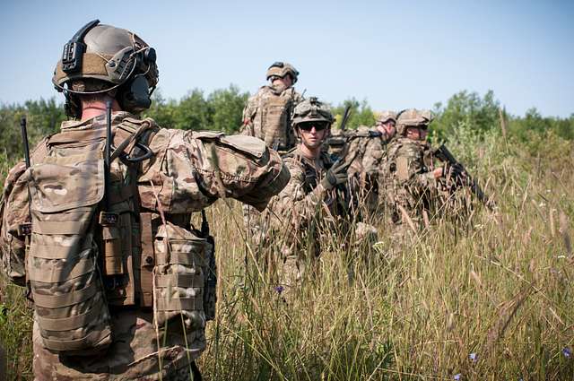 Second Lt. Paul Hauter, center, gives hand signals - NARA & DVIDS ...