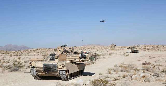 An M1 Abrams tank maneuvers through the National Training - PICRYL ...