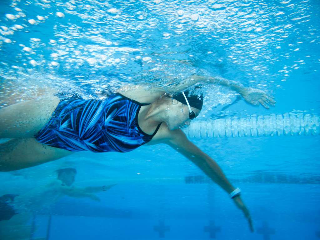 A contestant competes in the swim portion of the Quantico - PICRYL ...