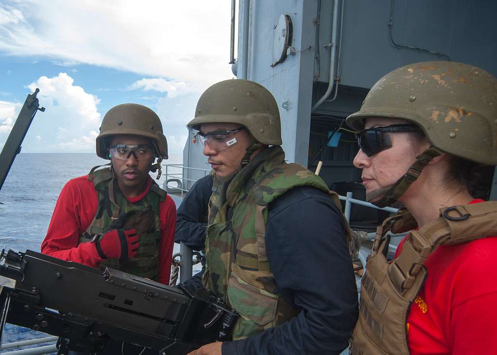 Aviation Ordnanceman Airman John Alexander, center, - PICRYL Public ...