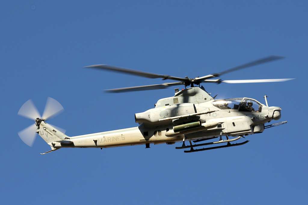 A U.S. Marine Corps AH-1W Cobra helicopter conducts - NARA & DVIDS ...