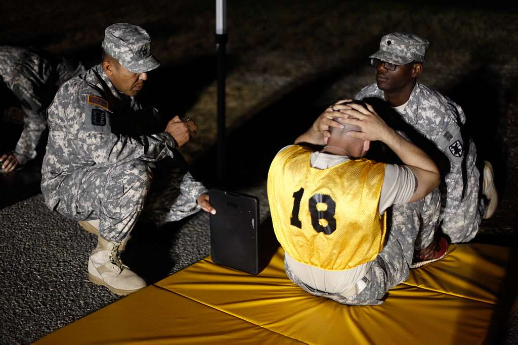 U.S. Army Staff Sgt. Michael Lemus performs situps PICRYL