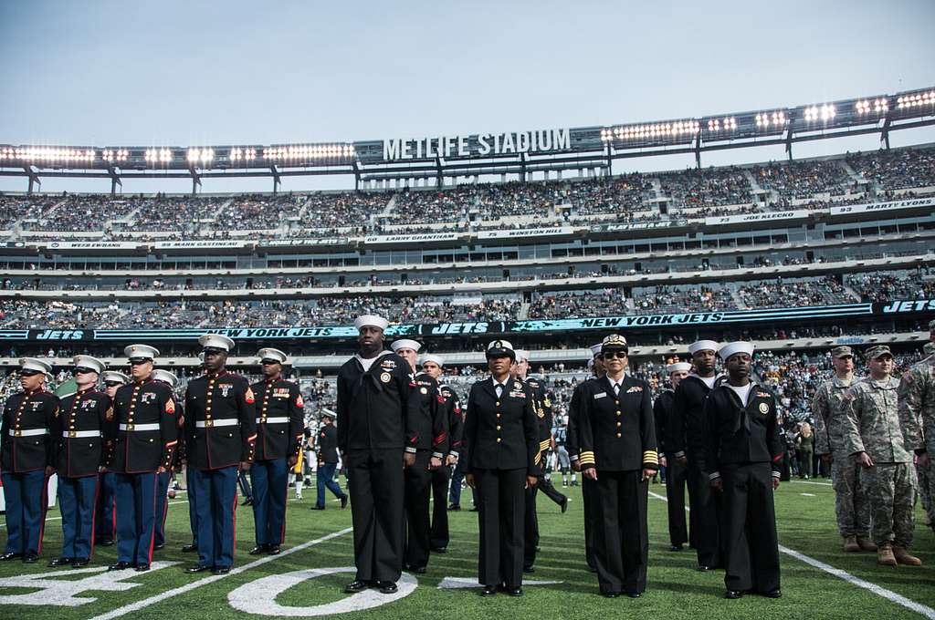 Vocalists from each military branch perform the national anthem during the New  York Jets' Salute to